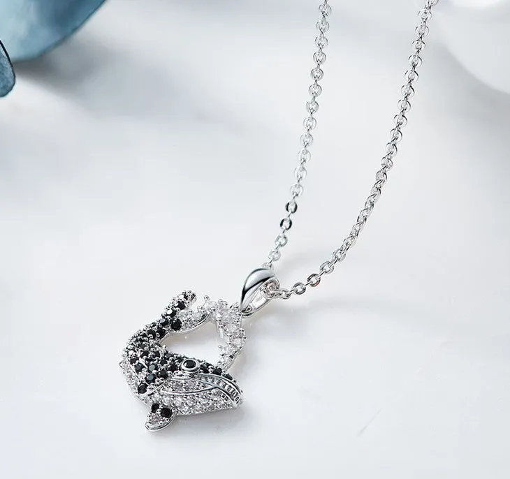 Black diamond whale necklace