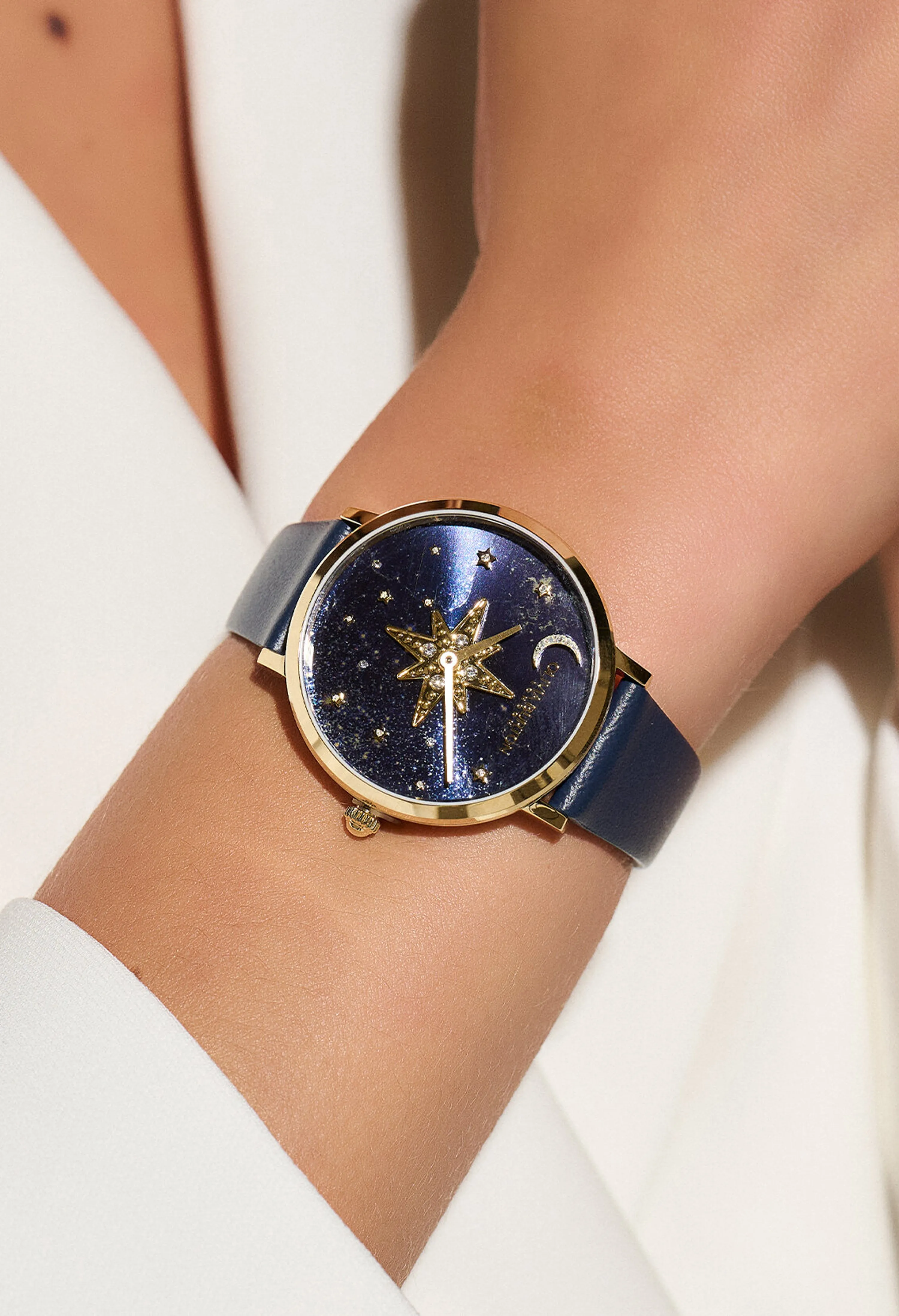 Olivia Burton women's celestial nova blue dial gold plated watch with strap.